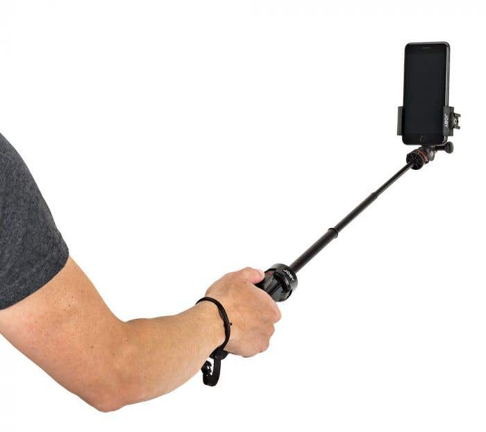 Home office setup with phone mount, microphone and LED light for remote work and video calls