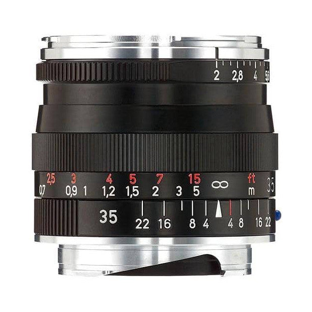 Close-up front view of black Zeiss Biogon 35mm lens showing focus and aperture rings with depth of field markings.