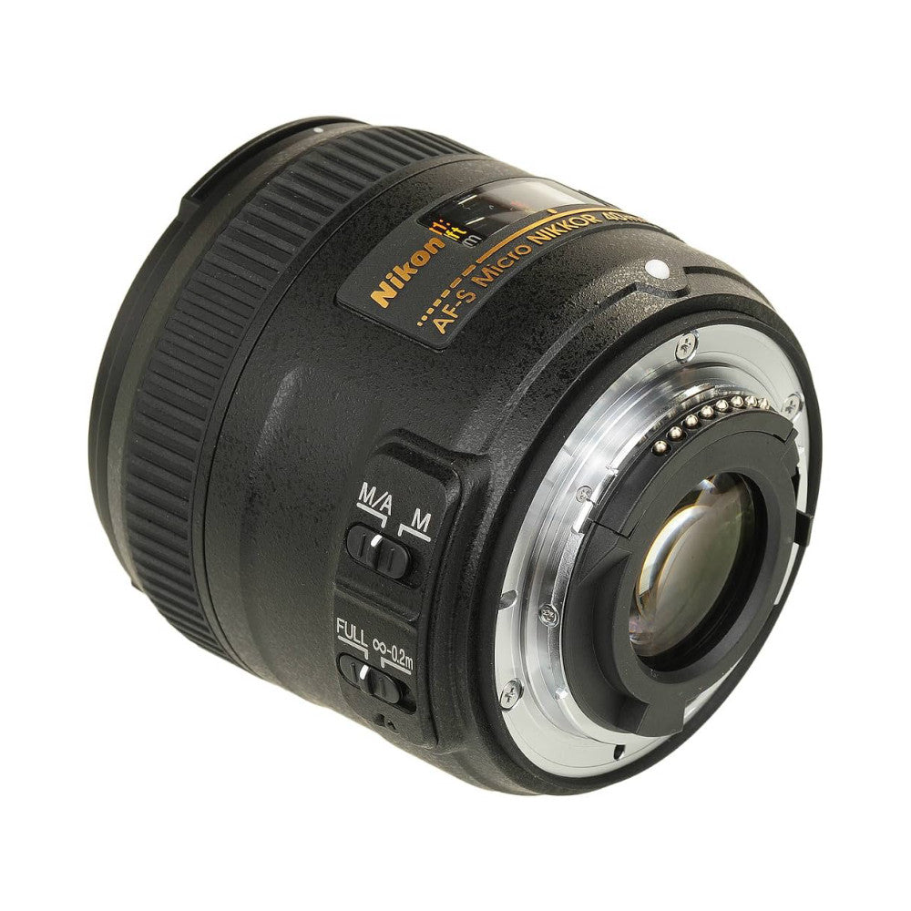 Rear three-quarter view of a black Nikon macro lens showing the mount, focus ring, and AF-S Nikkor branding against a white background.