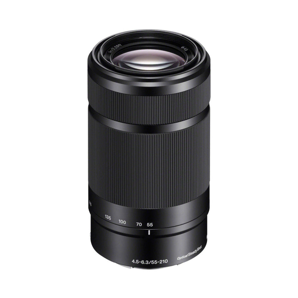 Black Sony E-mount telephoto zoom lens photographed against white background, showing front view with barrel, focus ring, and focal length markings from 55-210mm.