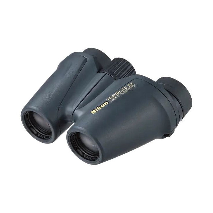 Angled front view of compact black Nikon Travelite binoculars showing both barrels and focusing wheel against white background.