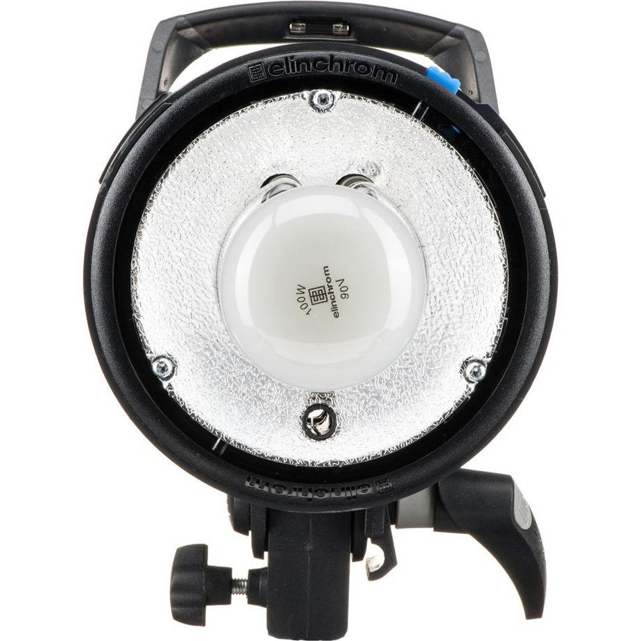 Top-down view of Elinchrom D-Lite RX4 flash head showing reflector bowl, central dome, and mounting bracket with blue indicator dot.