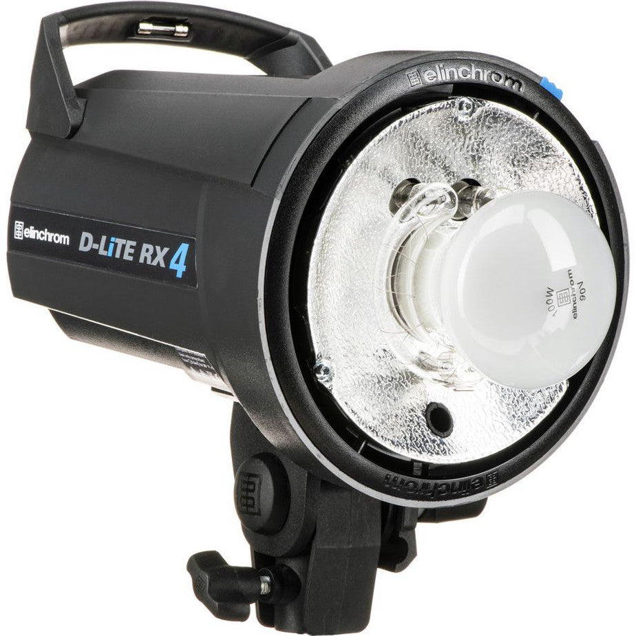 Black Elinchrom D-Lite RX4 flash head shown from the side angle, displaying the reflector bowl, lamp housing, and carrying handle against a white background.