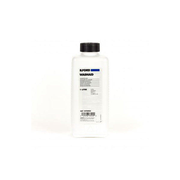 Front view of Ilford Washaid 1-liter bottle with black cap and white label against white background.
