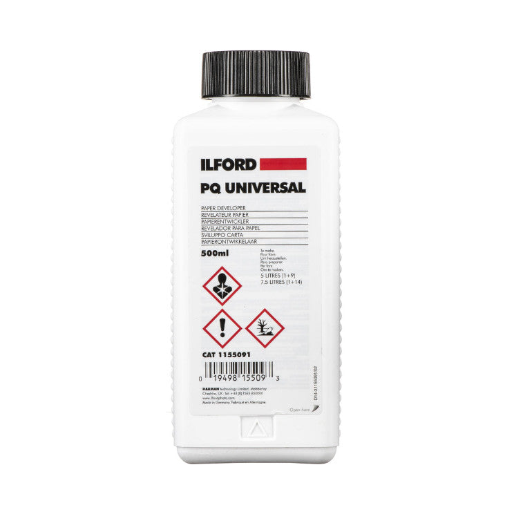Front view of Ilford PQ Universal Developer 500ml bottle with white label, black cap, and hazard warning symbols visible.