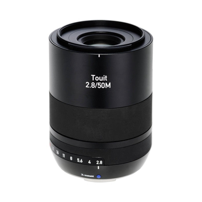 Black Zeiss Touit 2.8/50M macro lens shown from front angle against white background, displaying aperture ring and focus markings.