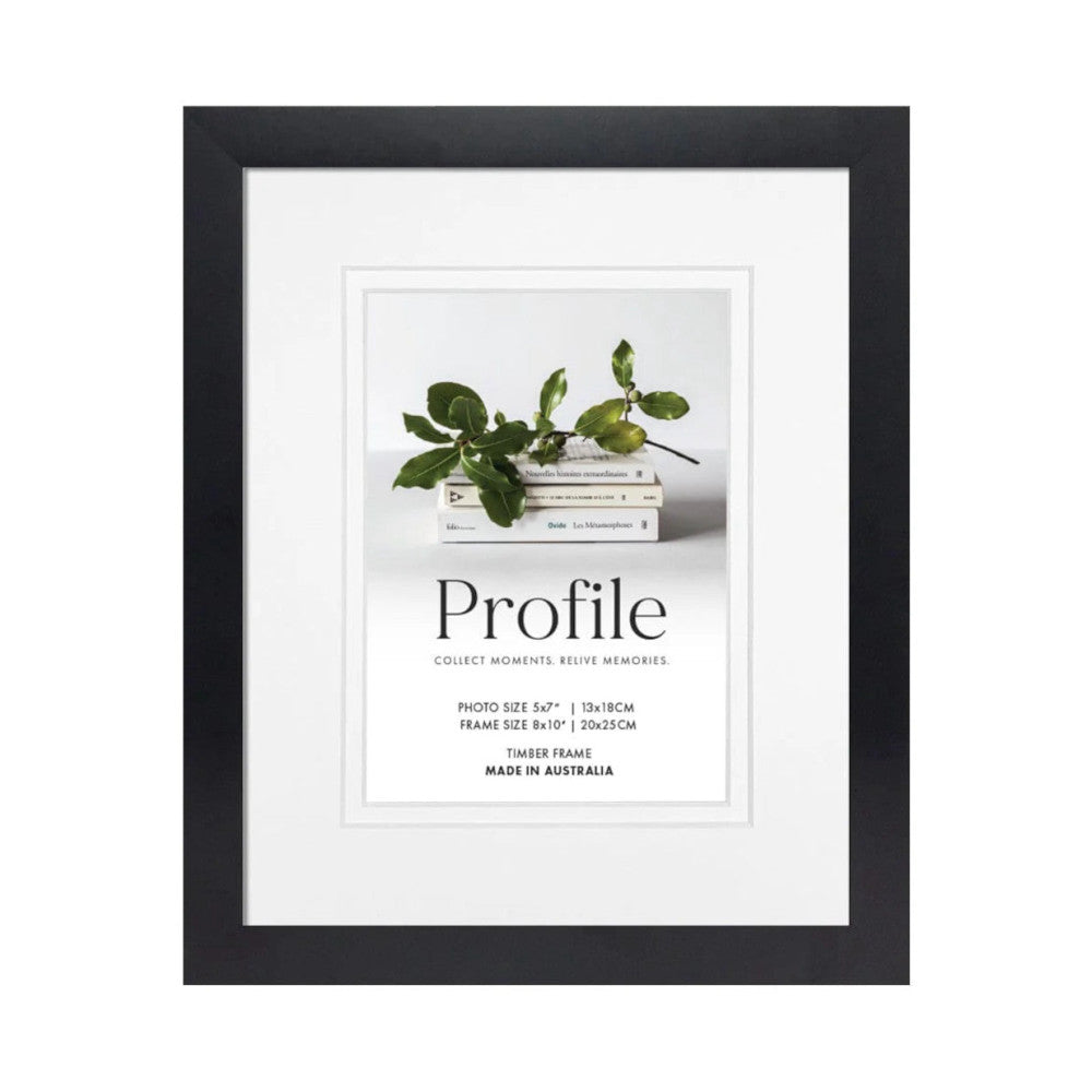 Black timber photo frame displaying a styled image of books with potted plant and "Profile" branding on white matting.
