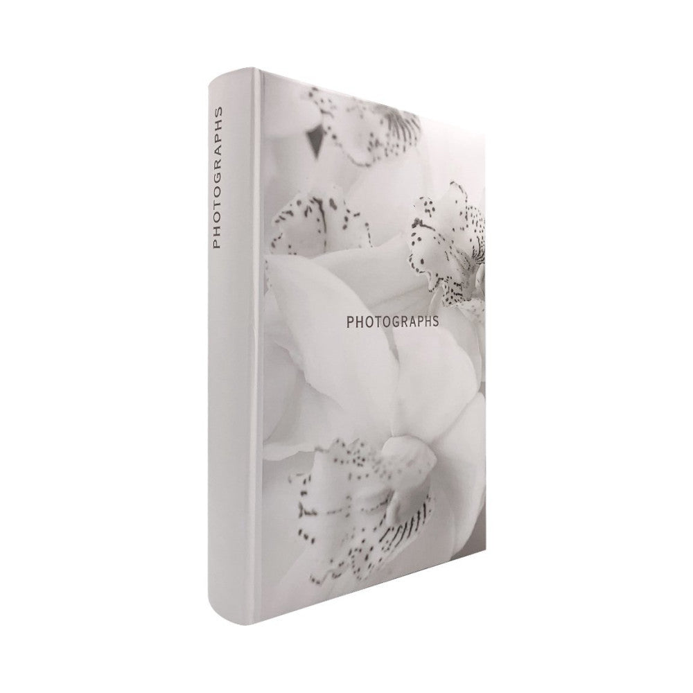 White photo album displayed at an angle showing spine with "PHOTOGRAPHS" text and cover featuring black and white orchid flower imagery.