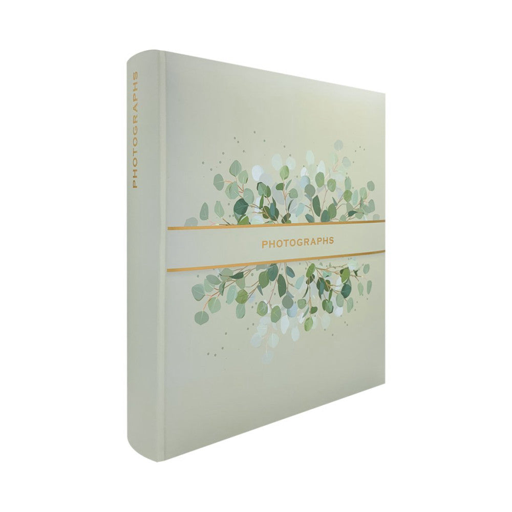 Cream-colored photo album displayed at three-quarter angle showing front cover with eucalyptus leaf design and gold "PHOTOGRAPHS" text band.