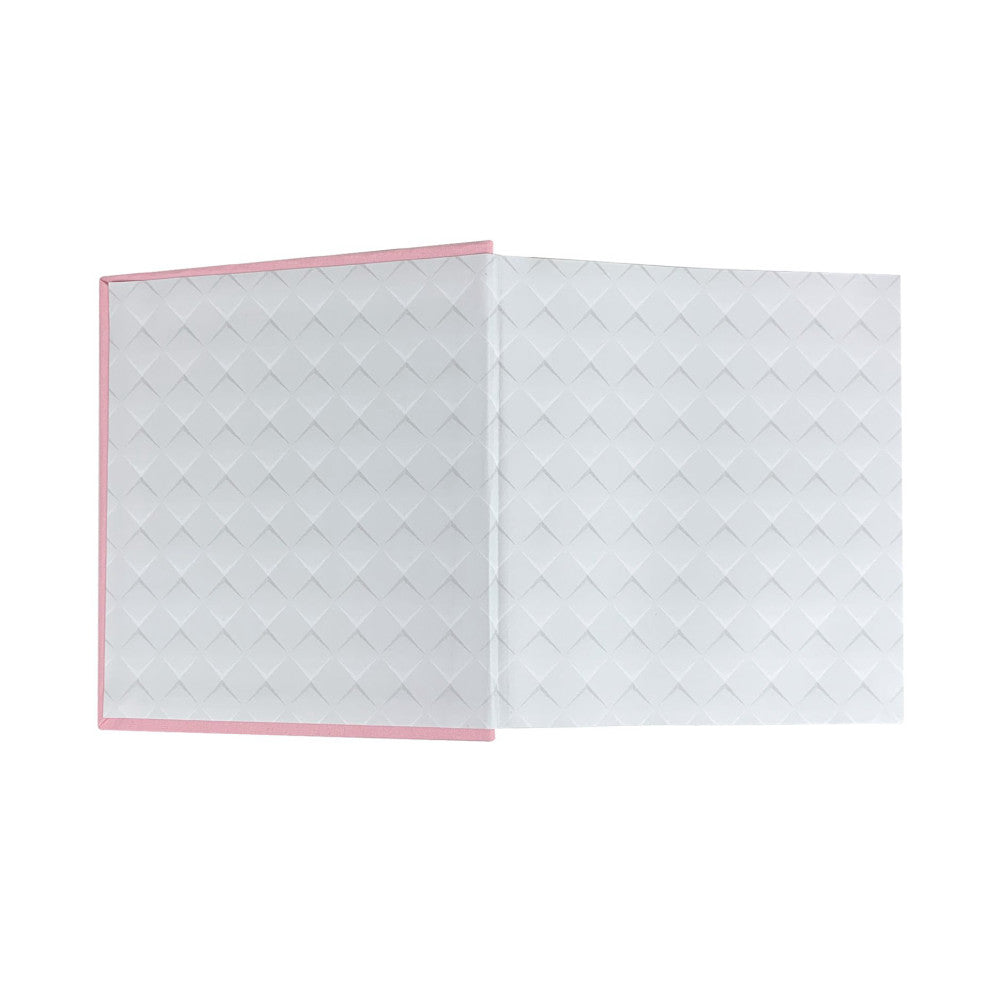 Open pink cloth photo album with white quilted interior pages, displayed at an angle showing inside spread.