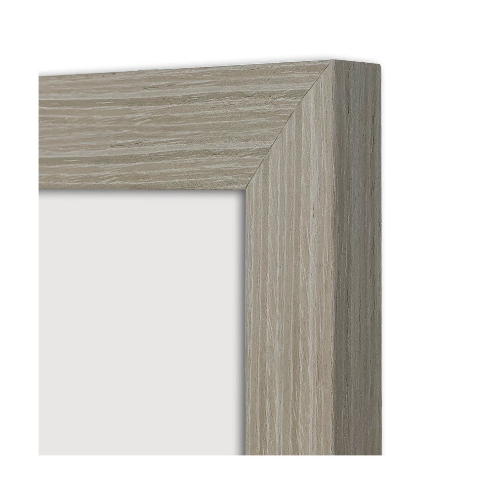 Close-up detail of wooden picture frame corner showing stone ash finish with wood grain texture and beveled edge.