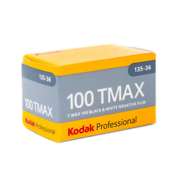 Product packaging box for Kodak TMAX 100 black and white film, shown at a three-quarter angle displaying the yellow and gray design.
