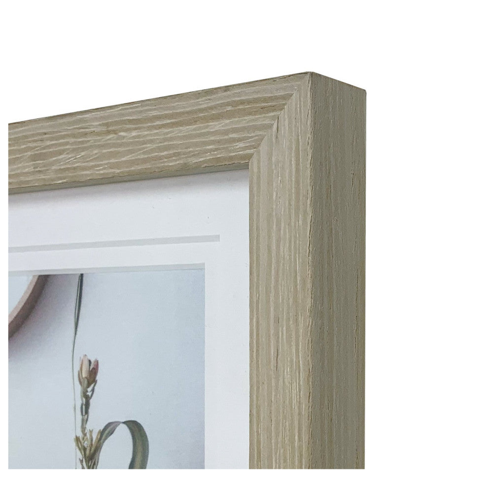 Close-up detail of the corner of a stone ash wood photo frame showing the textured grain and beveled edge profile.