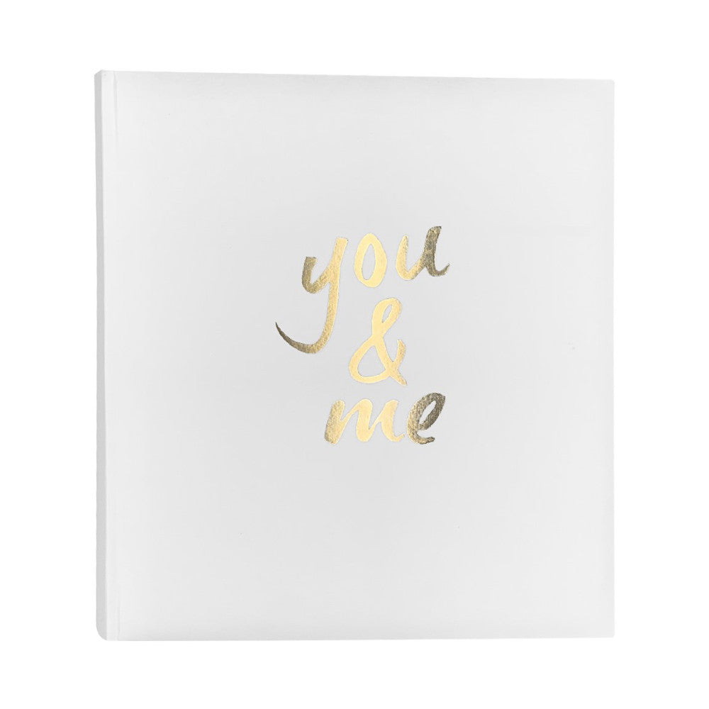 White slip-in photo album with gold foil text reading "you & me" on the front cover, displayed against a white background.