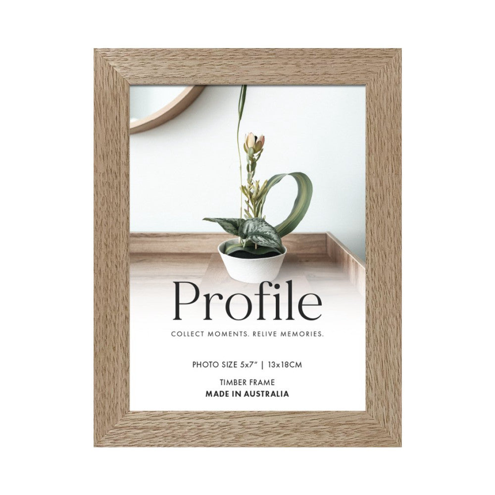 Front view of a light wood-toned picture frame displaying a minimalist botanical photo with potted plant and "Profile" branding text.