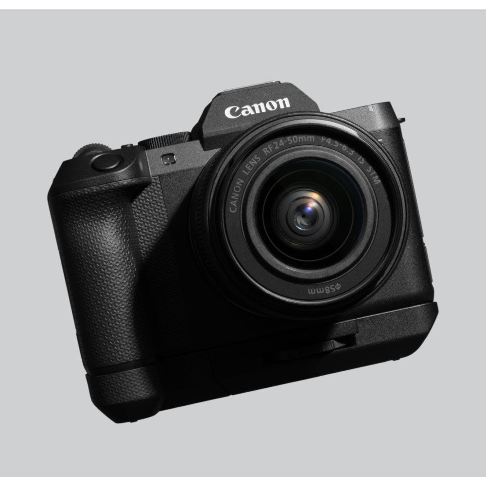 Canon EOS R mirrorless camera with RF 24-50mm lens and black extension grip attached, shown at three-quarter angle against gray background.