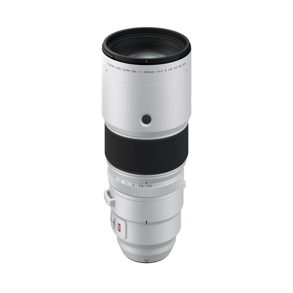 White and black telephoto lens shown in full profile view against white background, displaying barrel design with focus ring and aperture scale.