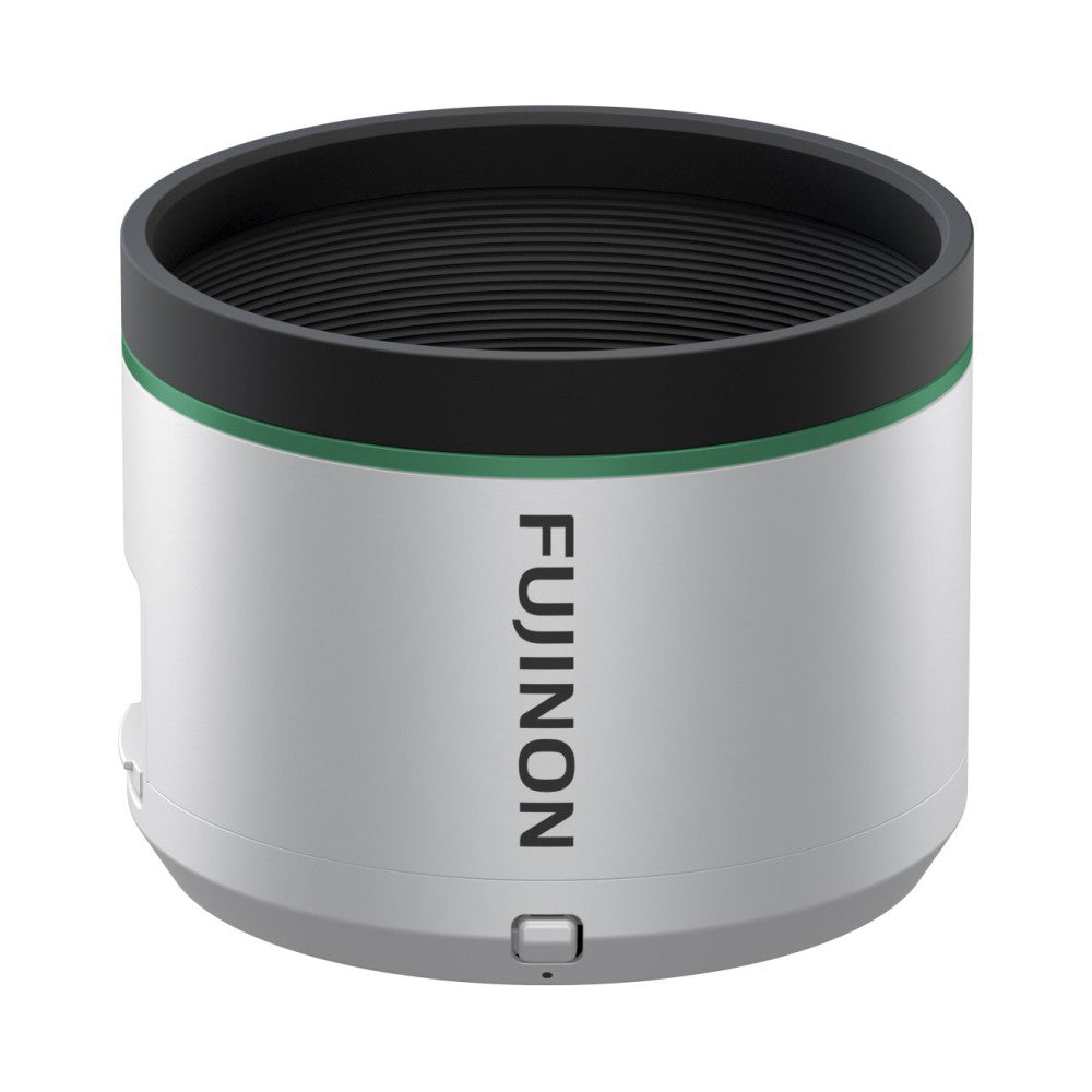 Cylindrical silver and black telephoto lens with green accent ring, shown at three-quarter angle against white background.