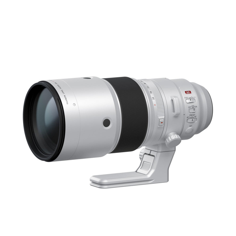 White telephoto lens with black focus ring shown from the left side angle against a white background, featuring a tripod foot attachment at the base.