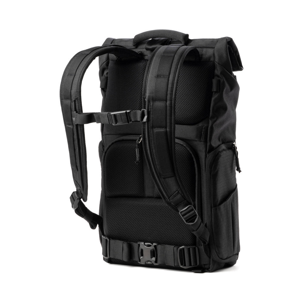Rear view of black Think Tank FocusPoint 30L camera backpack showing padded straps, mesh panels, and cinch straps.