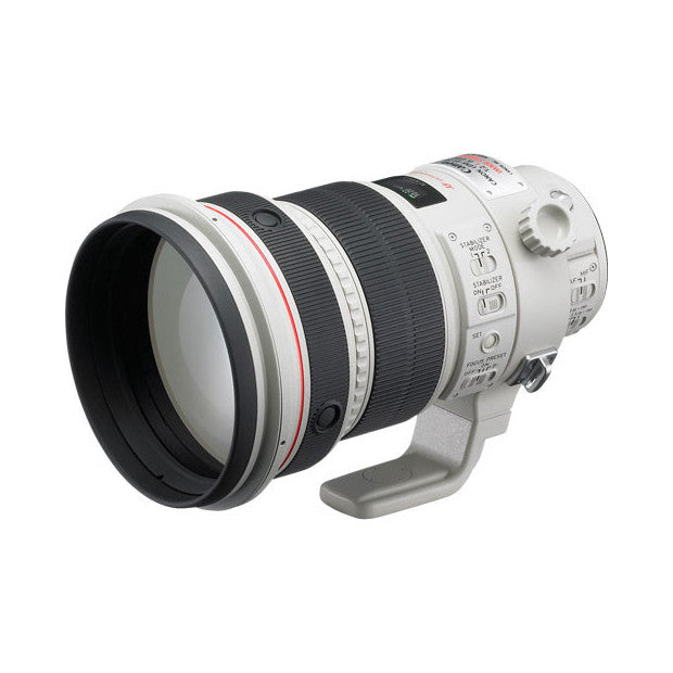 Canon EF 200mm f/2.0L IS USM telephoto lens shown from the side against a white background, displaying the white barrel, focus ring, and lens hood.