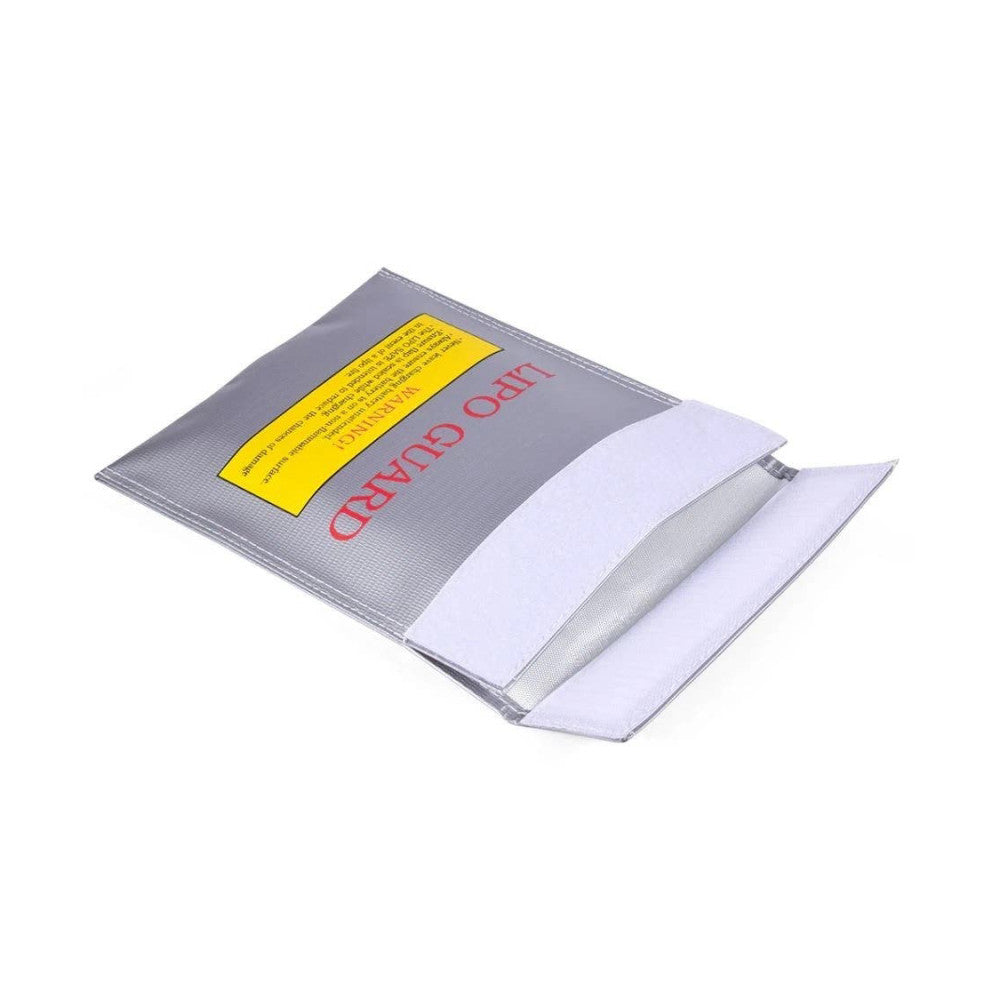 Open DJI LiPo Safe Bag displaying gray exterior with yellow warning label and red text, showing white interior padding and mesh compartment.