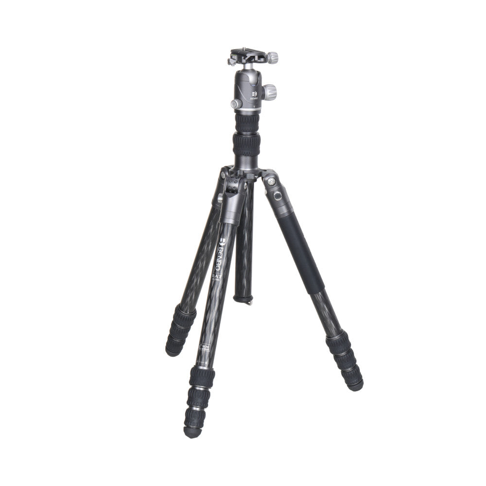Black carbon fiber tripod with ball head against white background, shown from front three-quarter angle in fully extended position.
