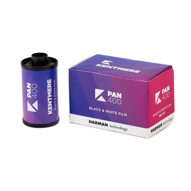 Kentmere Pan 400 black and white film canister and box packaging displayed side by side against white background.
