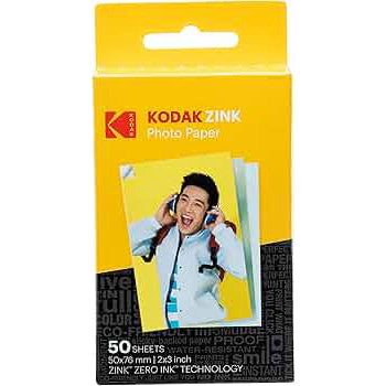 Front of Kodak ZINK Photo Paper 50-sheet pack showing yellow packaging with product image of smiling person and black ink technology details.