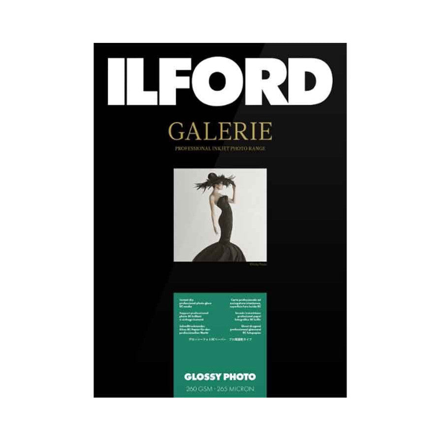 Front of Ilford Galerie Glossy Photo paper package showing black background, white brand name, product details, and artistic silhouette photograph sample.