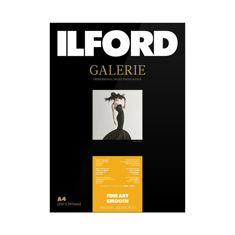 Product packaging for Ilford Galerie Fine Art Smooth paper showing front cover with brand logo, gold text, fashion photograph, and yellow specification panel below.