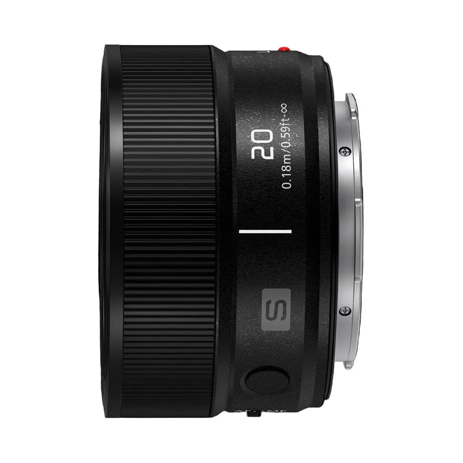 Side view of black Panasonic Lumix S 20mm F2.5 lens against dark background, showing barrel with focal length markings and focus ring detail.