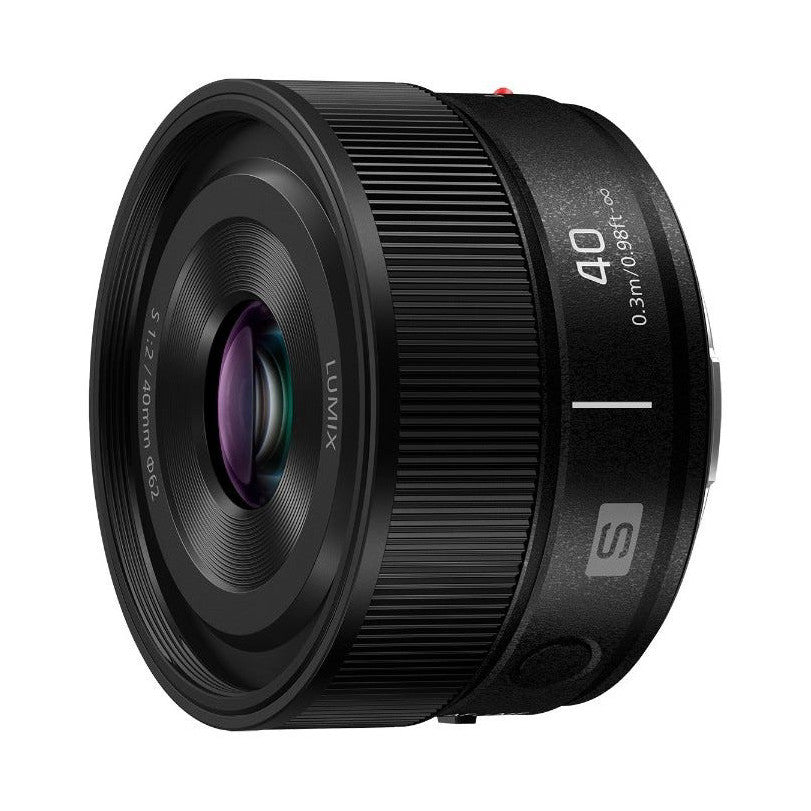 Black Panasonic Lumix S 40mm F2.8 macro lens shown from front angle, displaying purple-tinted glass elements and textured barrel design against white background.