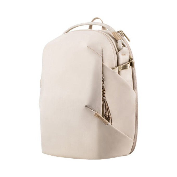 Cream-colored backpack shown from the front-angled view, displaying curved design with side pocket and top carry handle against white background.