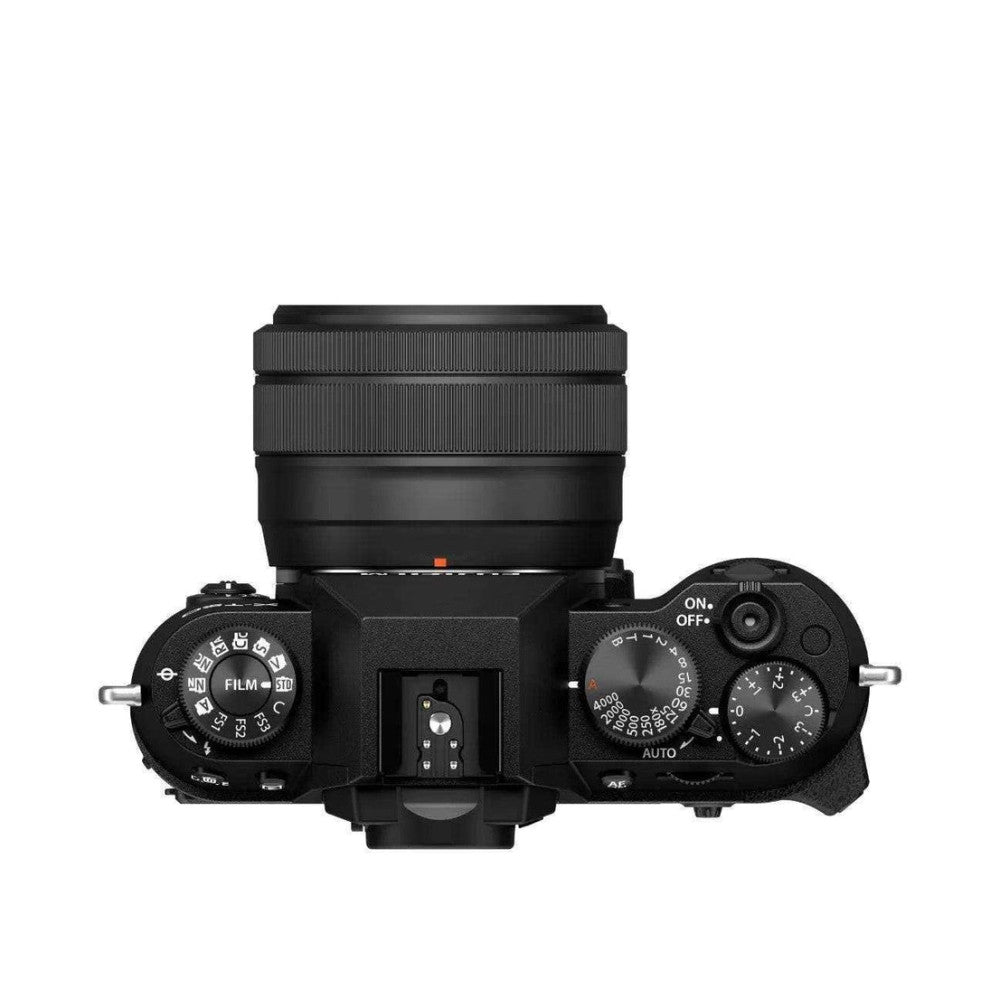Top-down view of black Fujifilm X-T50 camera with attached XC 35mm lens, showing dials, controls, and hot shoe against white background.