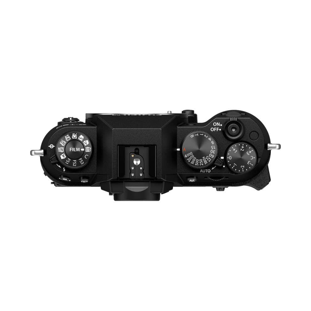 Top-down view of black Fujifilm X-T50 camera body showing dials, controls, and hot shoe against white background.