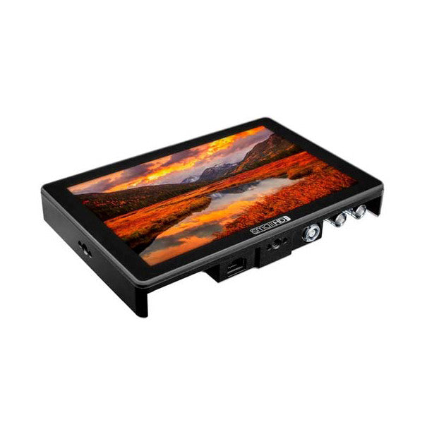 SmallHD CINE 7 Monitor displayed at an angled three-quarter view showing the screen displaying a landscape image with orange sunset tones and control buttons on the side.