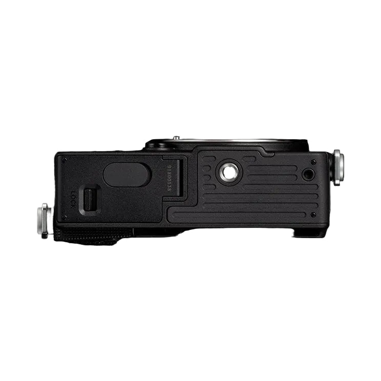 Top view of black Sigma FP2 mirrorless camera body showing lens mount, viewfinder, and control dials against black background.