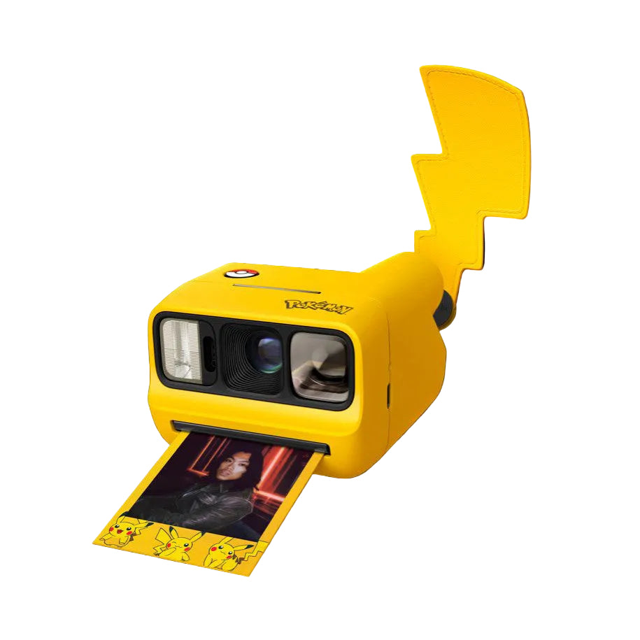 Yellow Polaroid GO camera with Pikachu-shaped design and ear-shaped viewfinder, shown at angle with instant photo ejecting from bottom slot.