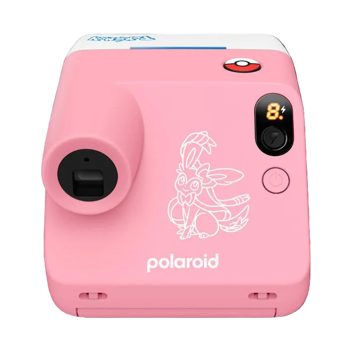 Front view of a pink Polaroid GO G3 camera with white Sylveon illustration, featuring a lens on the left, flash, viewfinder display showing 84, and power button.