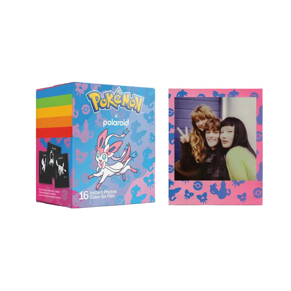 Polaroid Pokemon instant film box shown alongside a sample pink-framed photo displaying three young women, demonstrating the product's colorful design and photo output.