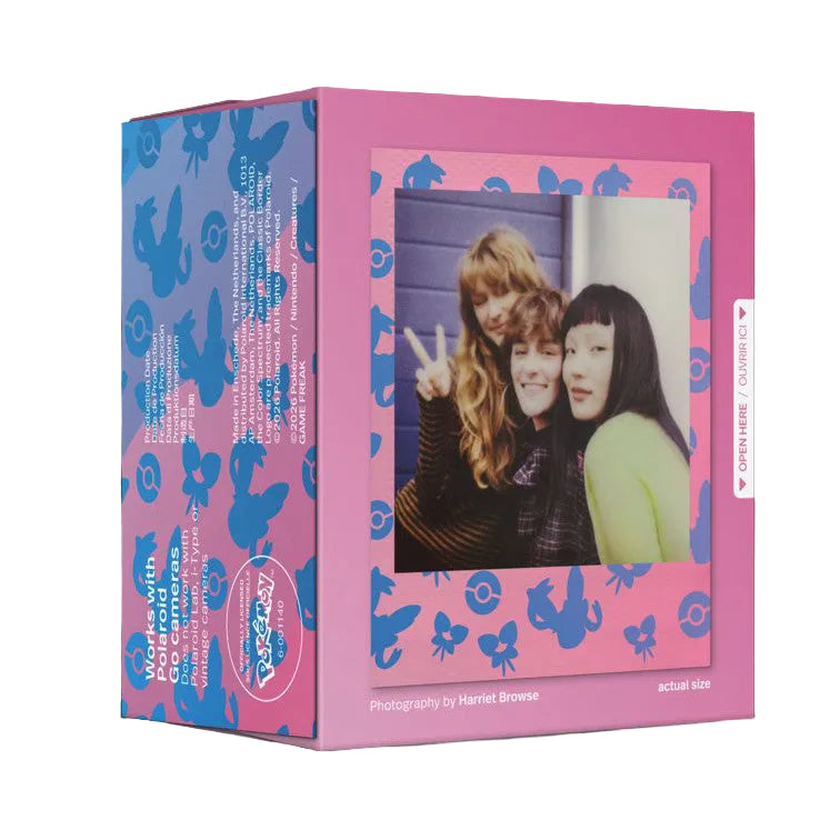 Pink and blue Polaroid film box displayed at an angle showing front cover with vintage photo of three young women and product details visible on sides.