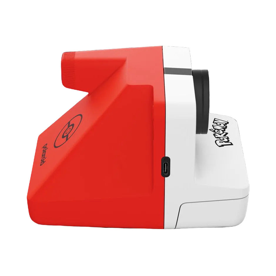 Red and white Polaroid 600 G3 Pokemon camera shown from a three-quarter side view against a black background.