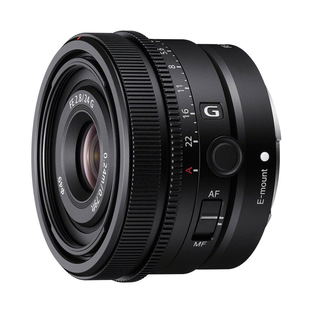 Front three-quarter view of a compact black Sony FE 24mm f/2.8 G lens showing focus ring, aperture markings, and E-mount interface.