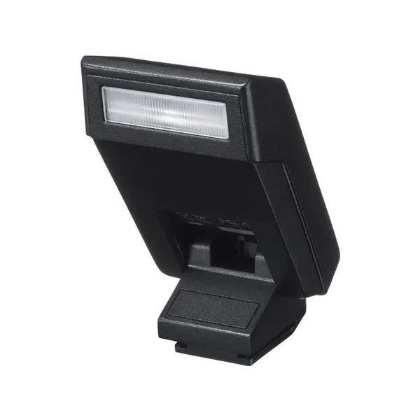 Black external camera flash unit shown at an angled side view against white background, displaying the reflective flash head and mounting foot.