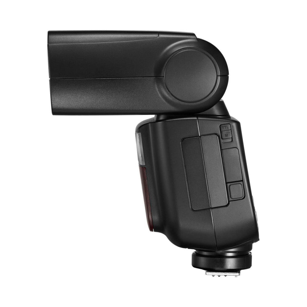 Black camera flash unit shown from side angle with flash head tilted upward and control buttons visible on back panel.