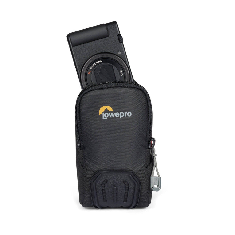 Black Lowepro camera case with compact camera partially inserted from top, showing front logo and protective padding detail.