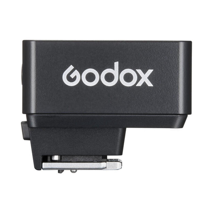 Top view of black Godox iT20 mini flash showing the brand logo and hot shoe mount connector at the bottom.