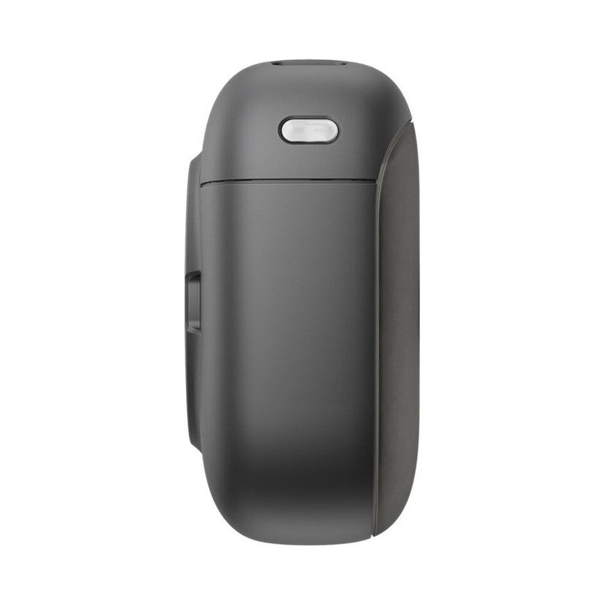 Side view of DJI MIC 3 TX Transmitter showing rounded dark gray body with button on top and side panel detail.
