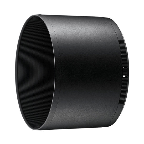 Black cylindrical lens hood shown at an angle against white background, displaying ribbed interior texture and front opening.